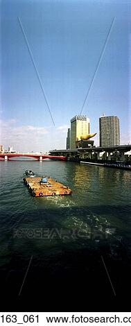 View of river with highway and buildings in the background View Large Photo Image Stock Image - View of river with highway and buildings in the background. Fotosearch