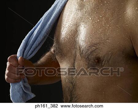Wet shirtless man with blue towel View Large Photo Image Stock Image - Wet shirtless man with blue towel. Fotosearch