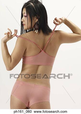 Stock Image - Woman in a bikini, back view. Fotosearch