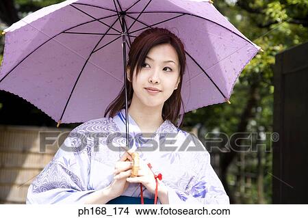 Picture - Woman in kimono, holding an umbrella. Fotosearch