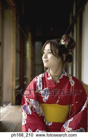 Woman in kimono kneeling by the corridor View Large Photo Image Stock Image - Woman in kimono kneeling by the corridor. Fotosearch