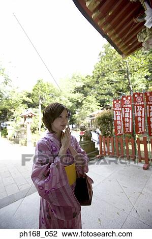 Woman in kimono praying View Large Photo Image Stock Image - Woman in kimono praying. Fotosearch