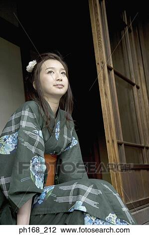 Woman in kimono sitting by the corridor View Large Photo Image Stock Image - Woman in kimono sitting by the corridor. Fotosearch