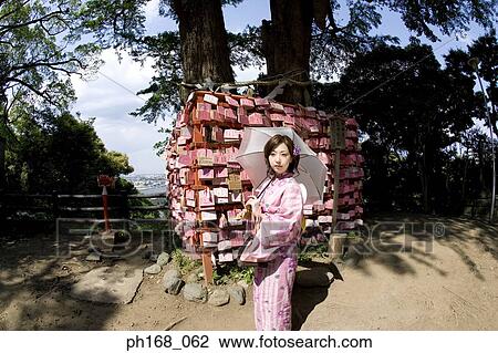 Woman in kimono with an umbrella View Large Photo Image Stock Image - Woman in kimono with an umbrella. Fotosearch