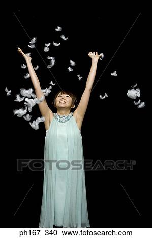 Woman playing with feathers View Large Photo Image Stock Image - Woman playing with feathers. Fotosearch