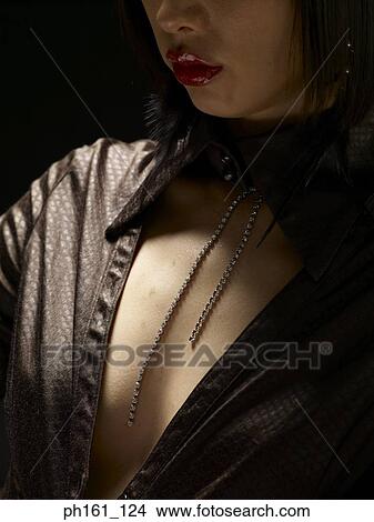 Picture - Woman wearing a black blouse. Fotosearch