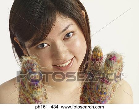 Woman wearing colorful mittens View Large Photo Image Picture - Woman wearing colorful mittens. Fotosearch