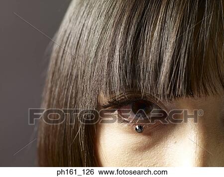 Woman with crystal on her lower eyelid, close-up View Large Photo Image Stock Photograph - Woman with crystal on her lower eyelid, close-up. Fotosearch