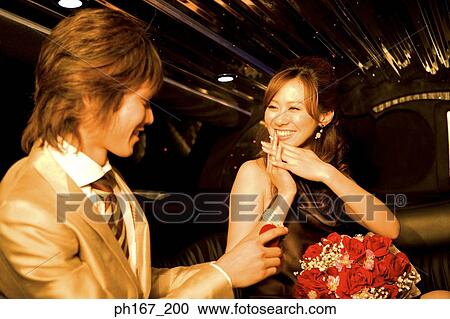 Young man presenting a gift to woman View Large Photo Image Stock Image - Young man presenting a gift to woman. Fotosearch