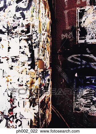 Graffiti and torn posters on wall View Large Photo Image Stock Image - Graffiti and torn posters on wall. Fotosearch