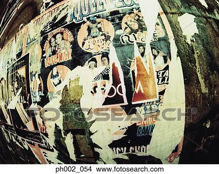Torn posters on wall View Large Photo Image Picture - Torn posters on wall. Fotosearch