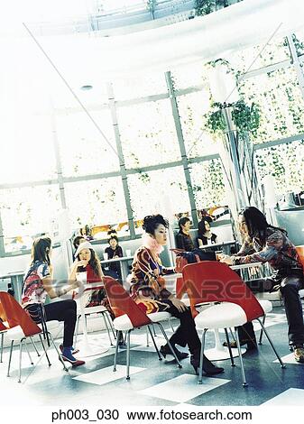 Diners at a café View Large Photo Image Stock Image - Diners at a café. Fotosearch