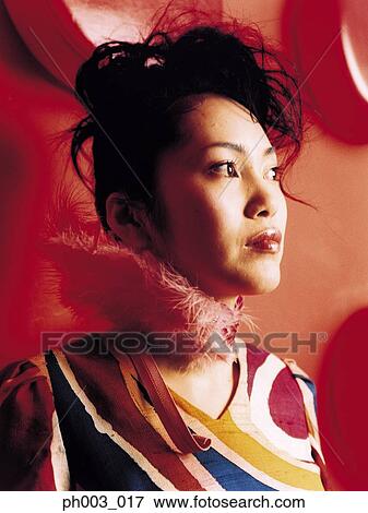 Young Asian woman, profile, close-up View Large Photo Image Stock Photo - Young Asian woman, profile, close-up. Fotosearch