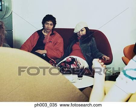 Stock Photography - Young couple at a café. Fotosearch