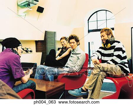 Friends gather at table View Large Photo Image Stock Image - Friends gather at table. Fotosearch