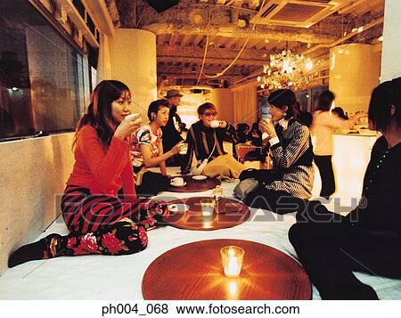 Group of friends chatting and drinks View Large Photo Image Stock Photo - Group of friends chatting and drinks. Fotosearch