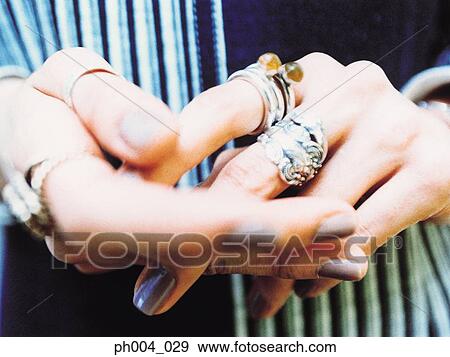 Hands, silver rings and painted nails, close up View Large Photo Image Stock Photo - Hands, silver rings and painted nails, close up. Fotosearch