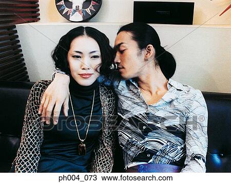 Man with arm around woman's shoulder, portrait View Large Photo Image Stock Image - Man with arm around woman's shoulder, portrait . Fotosearch