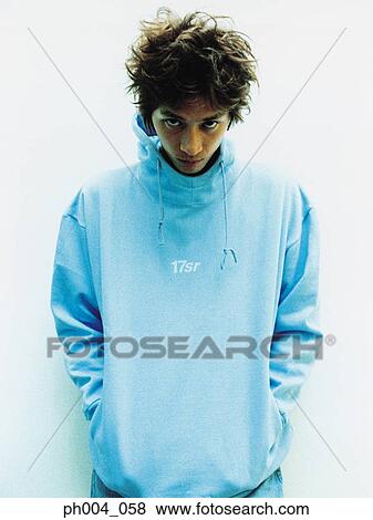 Young man wearing turtleneck sweatshirt, portrait View Large Photo Image Stock Photo - Young man wearing turtleneck sweatshirt, portrait. Fotosearch