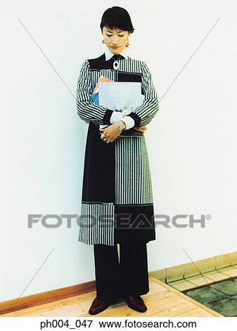 Young woman holding books View Large Photo Image Stock Photo - Young woman holding books . Fotosearch