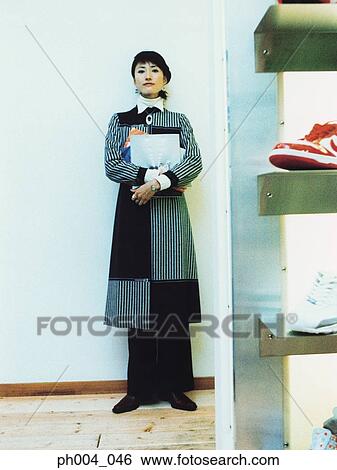 Young woman holding books View Large Photo Image Stock Photograph - Young woman holding books . Fotosearch