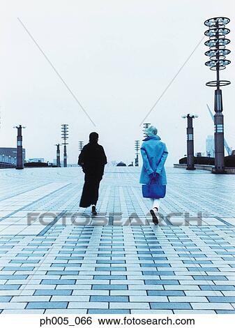 Stock Photograph - Two Woman walking, rear view. Fotosearch