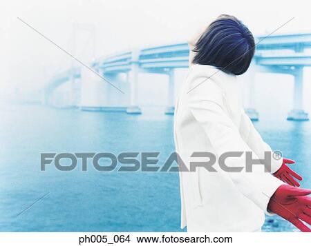 Young woman at waterfront, portrait View Large Photo Image Picture - Young woman at waterfront, portrait. Fotosearch