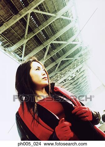 Young woman standing under bridge, portrait View Large Photo Image Picture - Young woman standing under bridge, portrait. Fotosearch
