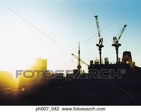 Construction site at sunset, silhouette View Large Photo Image Stock Image - Construction site at sunset, silhouette. Fotosearch
