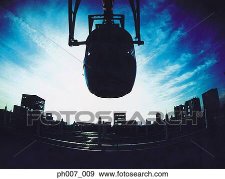 Stock Photo - Fisheye view of Ferris wheel cabin, silhouette. Fotosearch