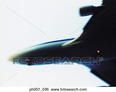 Passenger aircraft flying, elevated view View Large Photo Image Stock Photograph - Passenger aircraft flying, elevated view. Fotosearch