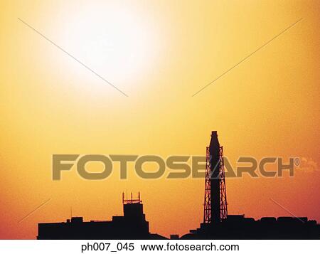 Silhouette buildings at sunset View Large Photo Image Stock Photography - Silhouette buildings at sunset. Fotosearch