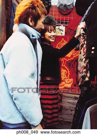Couple in a fashion store View Large Photo Image Stock Photo - Couple in a fashion store. Fotosearch
