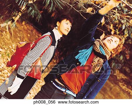Stock Photograph - Couple in a park. Fotosearch