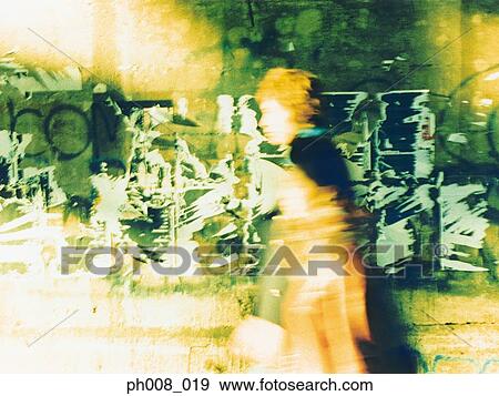 Stock Photo - Couple walking on the street. Fotosearch