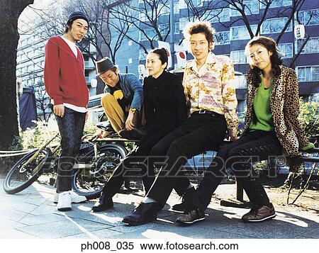 Group of people in a park View Large Photo Image Stock Photography - Group of people in a park. Fotosearch