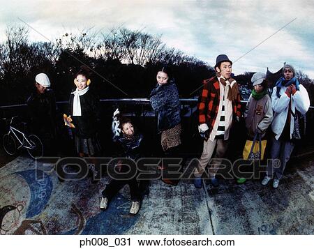 Stock Image - Group of people in winter wear. Fotosearch