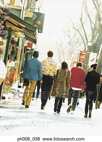 Stock Photo - Group of people walking on the street. Fotosearch