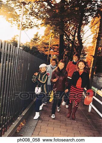 Stock Photo - Group of people walking on the street. Fotosearch