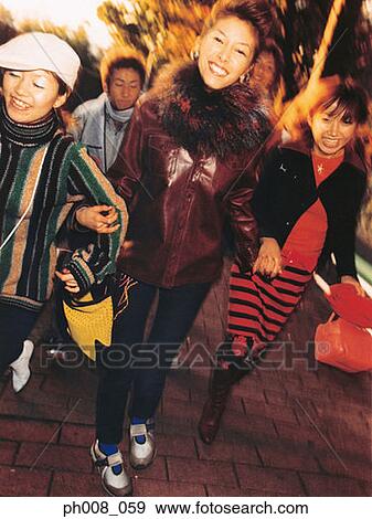 Stock Photo - Group of people walking on the street. Fotosearch