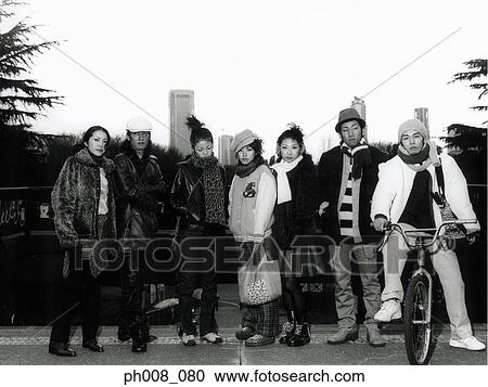 Stock Image - Portrait of a groups of people in winter wear. Fotosearch