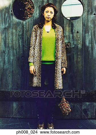 Picture - Portrait of an Asian woman standing. Fotosearch
