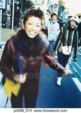 Young people crossing road View Large Photo Image Picture - Young people crossing road. Fotosearch