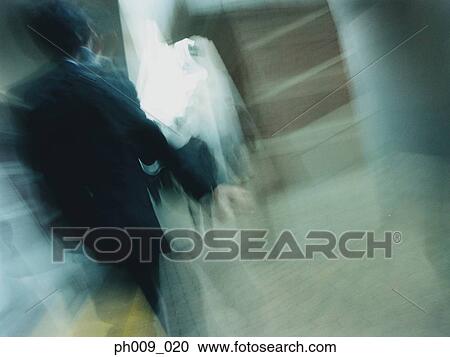 Commuters walking in subway passageway (blurred motion) View Large Photo Image Stock Image - Commuters walking in subway passageway (blurred motion) . Fotosearch