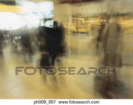 Commuters walking in subway passageway (blurred motion) View Large Photo Image Stock Photo - Commuters walking in subway passageway (blurred motion) . Fotosearch