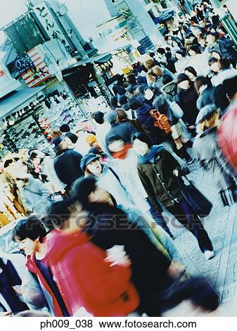 Crowd of people walking in Tokyo street View Large Photo Image Stock Photo - Crowd of people walking in Tokyo street. Fotosearch
