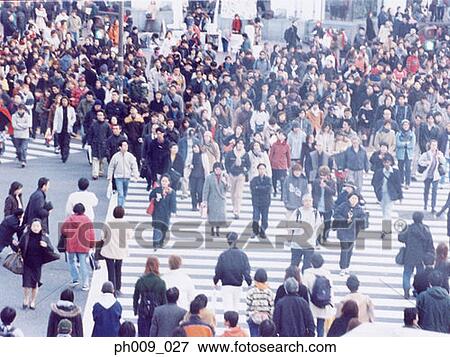 Large crowd of people crossing city street, Shibuya, Tokyo, Japan View Large Photo Image Stock Photo - Large crowd of people crossing city street, Shibuya, Tokyo, Japan . Fotosearch