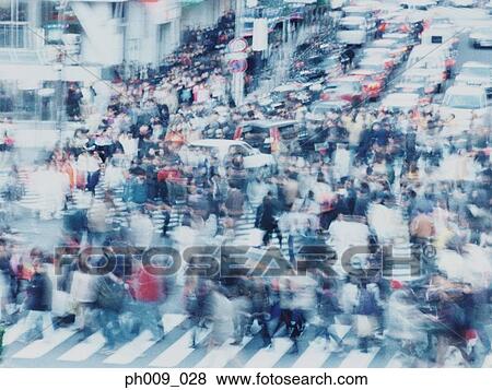 Large crowd of people crossing city street, Shibuya, Tokyo, Japan View Large Photo Image Stock Photo - Large crowd of people crossing city street, Shibuya, Tokyo, Japan . Fotosearch