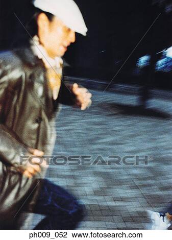 Stock Image - Man running on walkway . Fotosearch