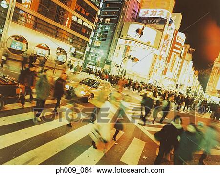 Pedestrians crossing street, night, Shibuya-ku, Tokyo, Japan View Large Photo Image Picture - Pedestrians crossing street, night, Shibuya-ku, Tokyo, Japan. Fotosearch